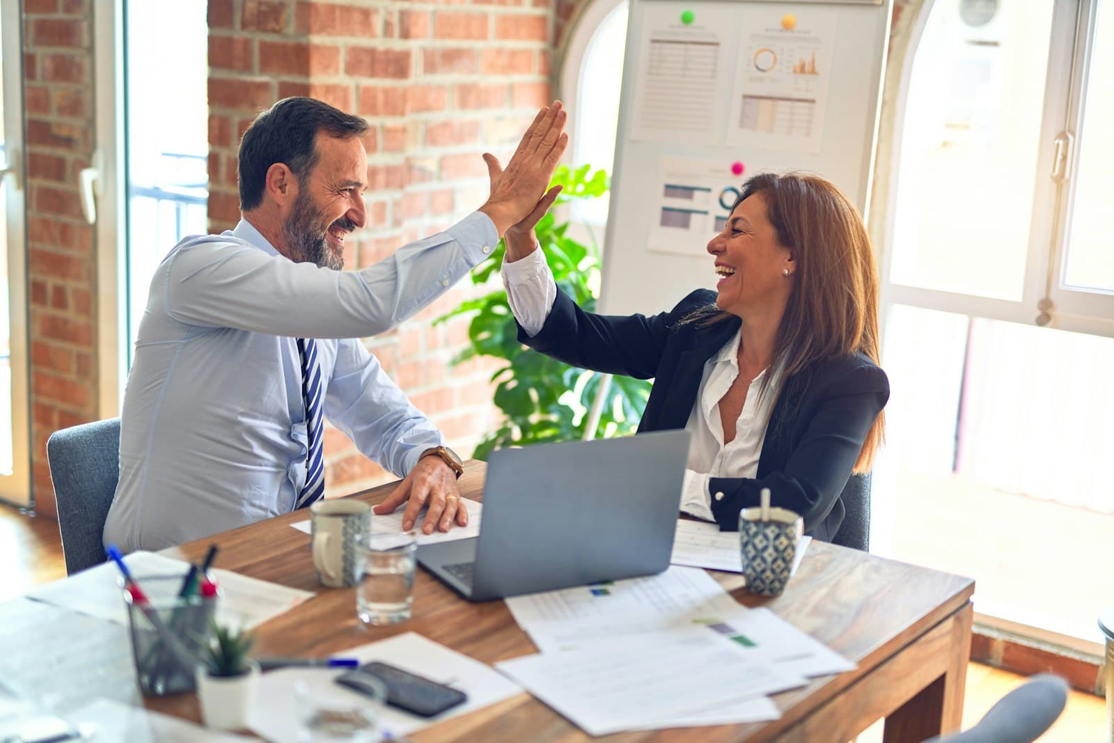 SEO consultant and client agreeing on a strategy in a Melbourne office